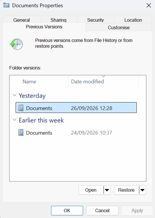 Previous Versions window showing available versions of the Documents folder in Windows 11
